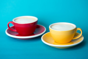 yellow and red cup on a blue background