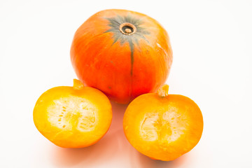 Fresh sliced pumpkin(squash), apples, glass jar of honey isolated on white background. Food, Thanksgiving day concept. Top view. Space for a text. Flat lay. Close up.