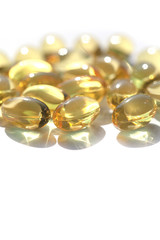 Capsules with fish oil, vitamins A and D. Vertical image