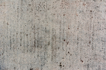 Texture of a concrete wall with cracks and scratches which can be used as a background