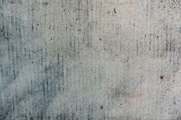 Texture of a concrete wall with cracks and scratches which can be used as a background