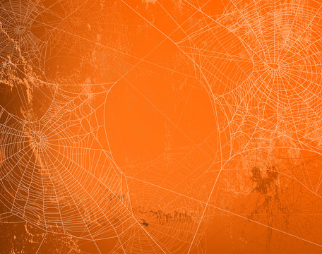 shabby orange wall covered with spooky spider web - halloween theme bright copy space background