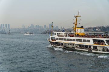 ferries of istanbul, also known as vapur. Marmara sea and Istanbul cityscape in the background. Bosphorus ride.