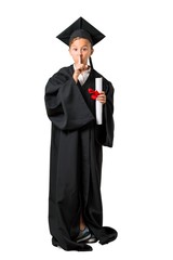 Full body of Little boy graduating showing a sign of closing mouth and silence gesture on isolated white background