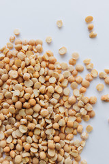 Glass jar with raw dry peas, macro 