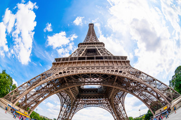 Fototapeta na wymiar The Eiffel Tower in Paris on a beautiful summer day with blue sky in the background