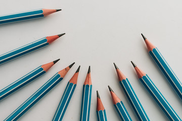 Composition of pencils on white background