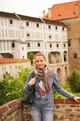 girl on an excursion in an old European city. European travel and leisure. Travel yourself.