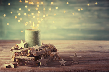 First Advent Sunday - Christmas candle with magic lights  -  Natural advent decoration -  Wreath made of twigs  -  Rustic  simple background  - 293134137