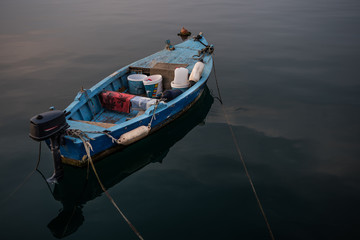Old Wooden Fisher Boat On Calm Water In Harbor