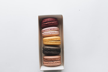 Box with delicious bright macaroons, sweet dessert