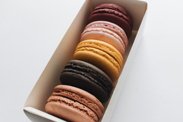 Box with delicious bright macaroons, sweet dessert