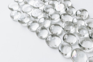 Scattered crystals on white background, beautiful gems