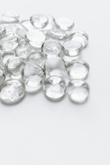 Scattered crystals on white background, beautiful gems