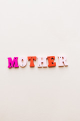 Colorful wooden letters, MOTHER  lettering