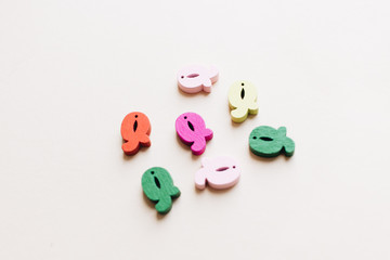 Colorful small wooden Q letters