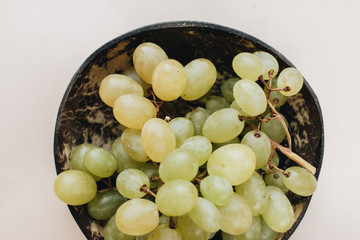 Pile of fresh green grapes on white background