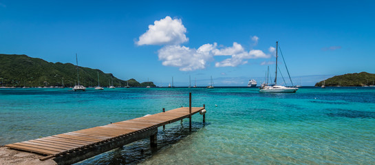 Panoramic sea and harbor view with wooden pier at the beach of Bequia, St Vincent and the...