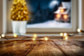 Christmas window sill with wooden desk of free space for your decoration. 
