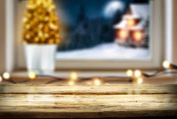 Christmas window sill with wooden desk of free space for your decoration. 