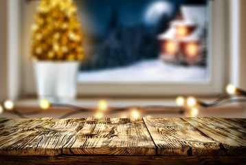 Christmas window sill with wooden desk of free space for your decoration. 
