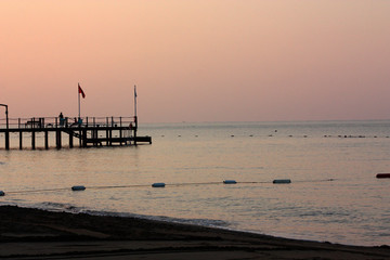 Fototapeta na wymiar Romanticly view of the sea, sunset, fishing boats, Turkey.
