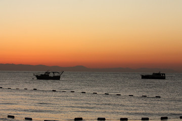 Romanticly view of the sea, sunset, fishing boats, Turkey.