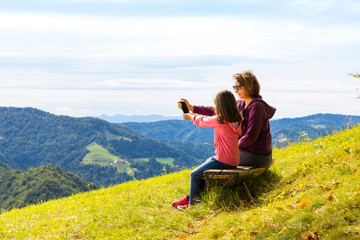 Modern lifestyle in the nature. Active mother and daughter.