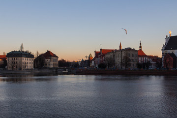 View of the river embankment in the city of Wroclaw at sunset. Poland