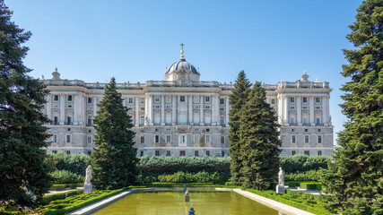 Public garden and the Royal Palace in Madrid in a beautiful summer day, Spain