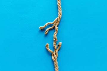 risk concept with rope near to break on blue background top view space for text