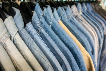 Denim Shirts on Hangers on a Shop Wardrobe Closet Rail