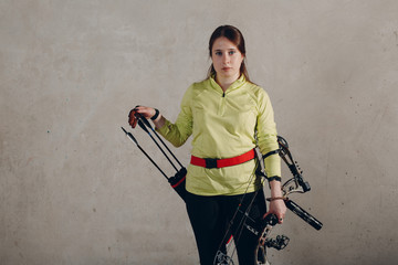 Archer woman with modern block sport olympic bow and arrow and quiver
