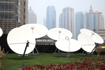 Satellite dish space technology receivers with modern buildings backgrounds