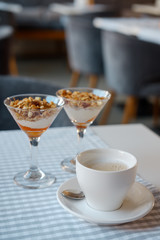 Granola in glass ice-cream bowls. close-up.