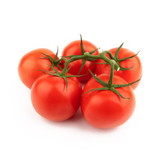 Group red tomatoes whole on a green branch. Isolated on a white background.