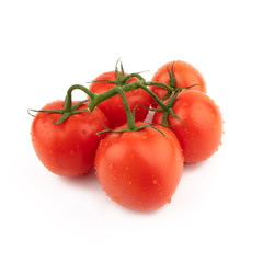 Group red tomatoes whole on a green branch. Isolated on a white background.