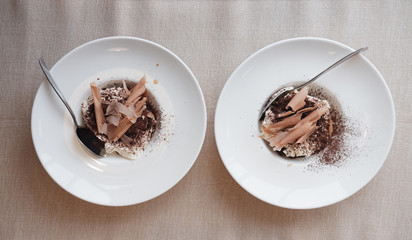 two ice cream with chocolate chips and topping
