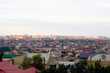 View of city Kuala Lumpur skyline is a silhouette that an urban center's buildings create against the surrounding landscape. Urban landscape against the sky. Makhachkala against the sky