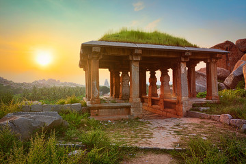 Ancient ruins in Hampi on sunset. India
