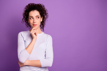 Photo of charming lady thinking about important decision looking empty space wondered to find answers wear pullover isolated purple color background