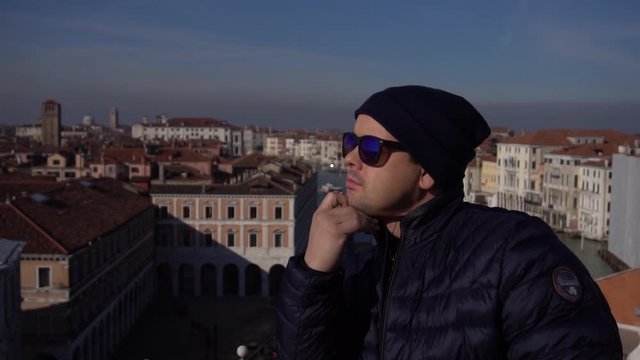 Man watching cityscape in venice, italy