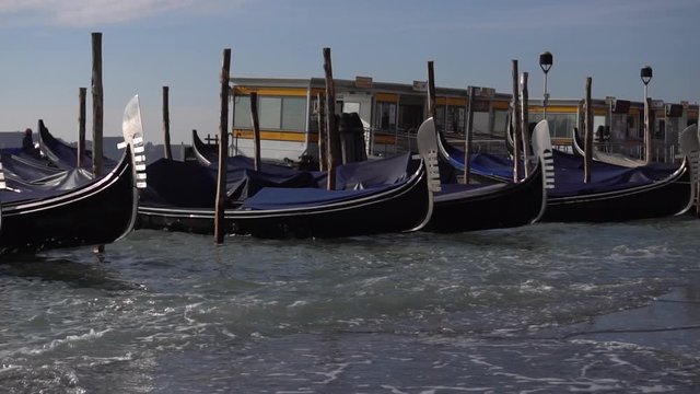 Gondolas and the boats are at the pier