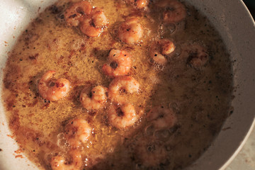 Fry the prawns in hot olive oil. Grill in the open air