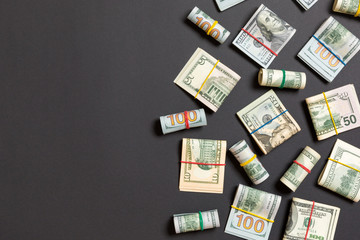 Fototapeta na wymiar Pile of one hundred US Dollar Bills money on colored background top wiev with copy space for your text in financial concept