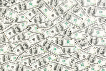 Top view of one hundred dollar banknotes made as a background. USD currency concept. Texture of American dollars