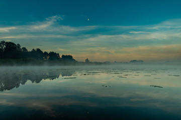  morning mist over the river in sunrise in Latvia river Vecdaugava