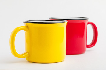 Enameled iron mug, on white background.