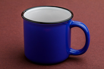 iron mug, on red background.