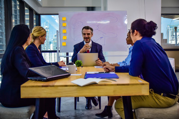Business team working group meeting in office